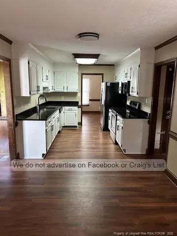 a view of living room with furniture and flat screen tv
