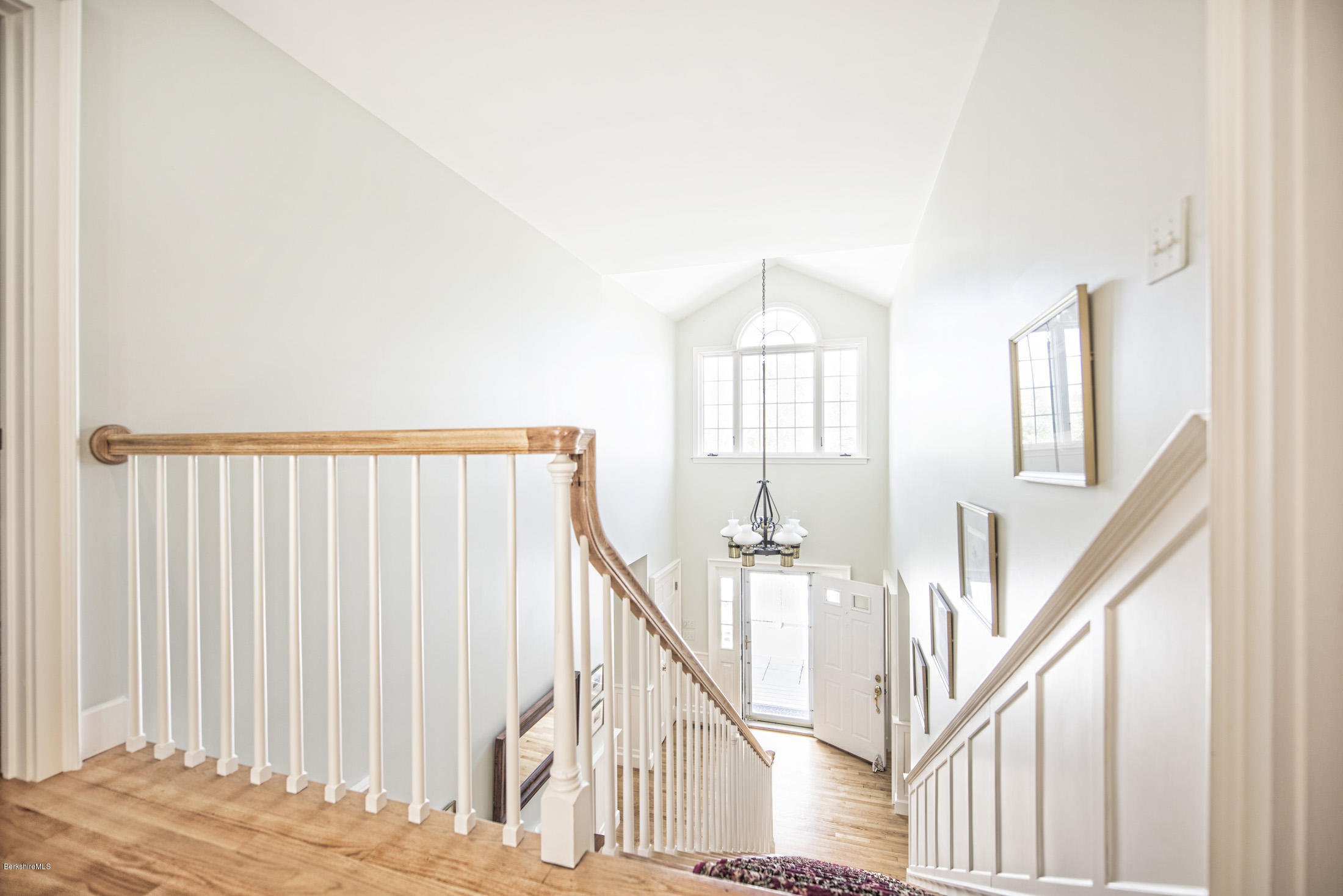 1136 Barker Road, Unit 36 Pittsfield, MA 01201 - Photo 13 of 28 a view of entryway with wooden floor and stairs