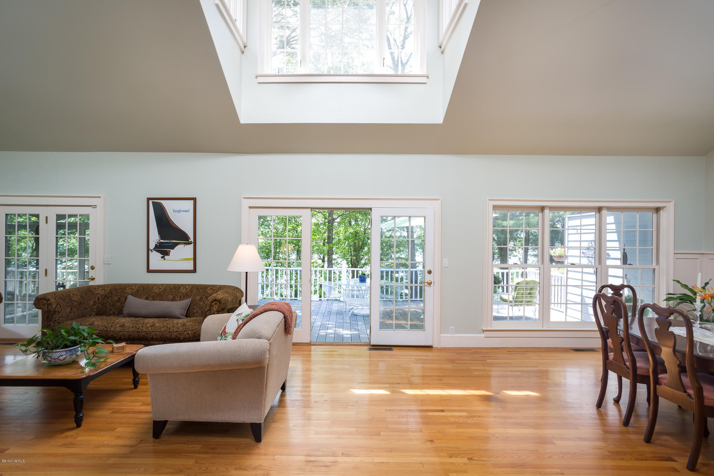 1136 Barker Road, Unit 36 Pittsfield, MA 01201 - Photo 4 of 28 a living room with furniture and floor to ceiling windows