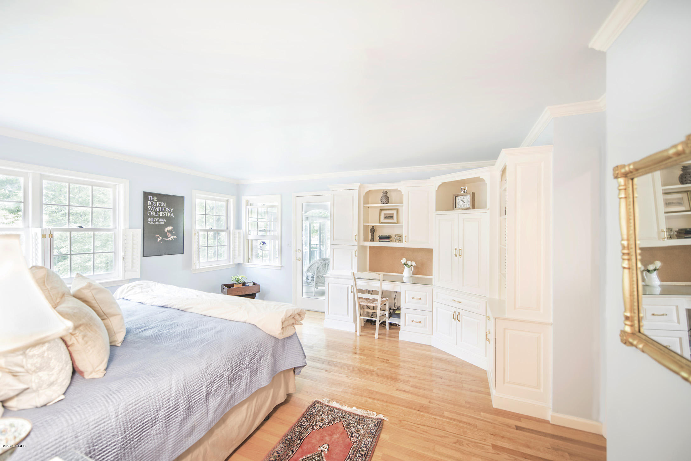 1136 Barker Road, Unit 36 Pittsfield, MA 01201 - Photo 10 of 28 a spacious bedroom with a bed a table and windows