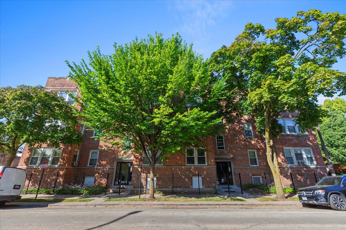 120 Custer Avenue, Unit 3 Evanston, IL 60202 - Photo 1 of 15 front view of a house with a tree