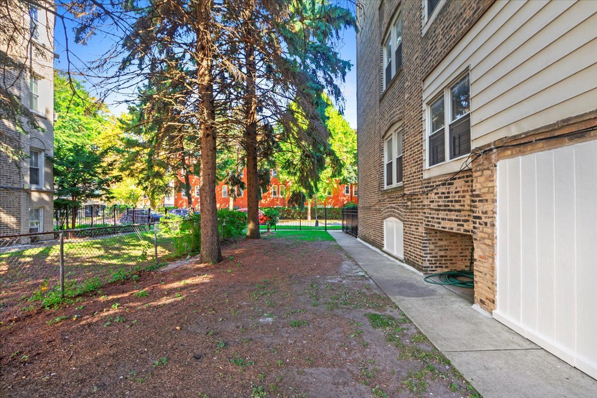 120 Custer Avenue, Unit 3 Evanston, IL 60202 - Photo 15 of 15 a pathway of a house with a yard