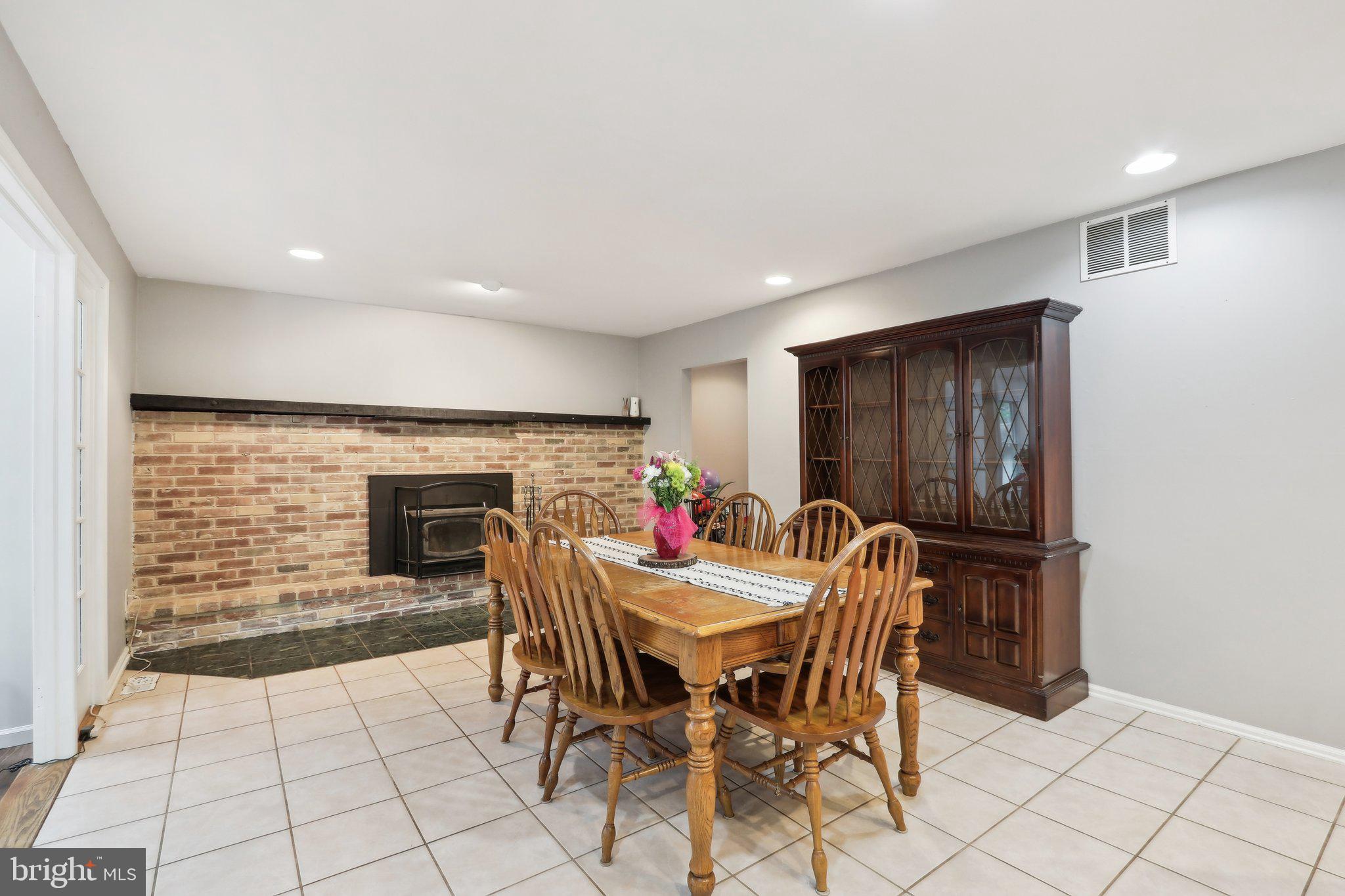 595 Tabernacle Road Medford, NJ 08055 - Photo 23 of 65 a dining room with furniture and a fireplace