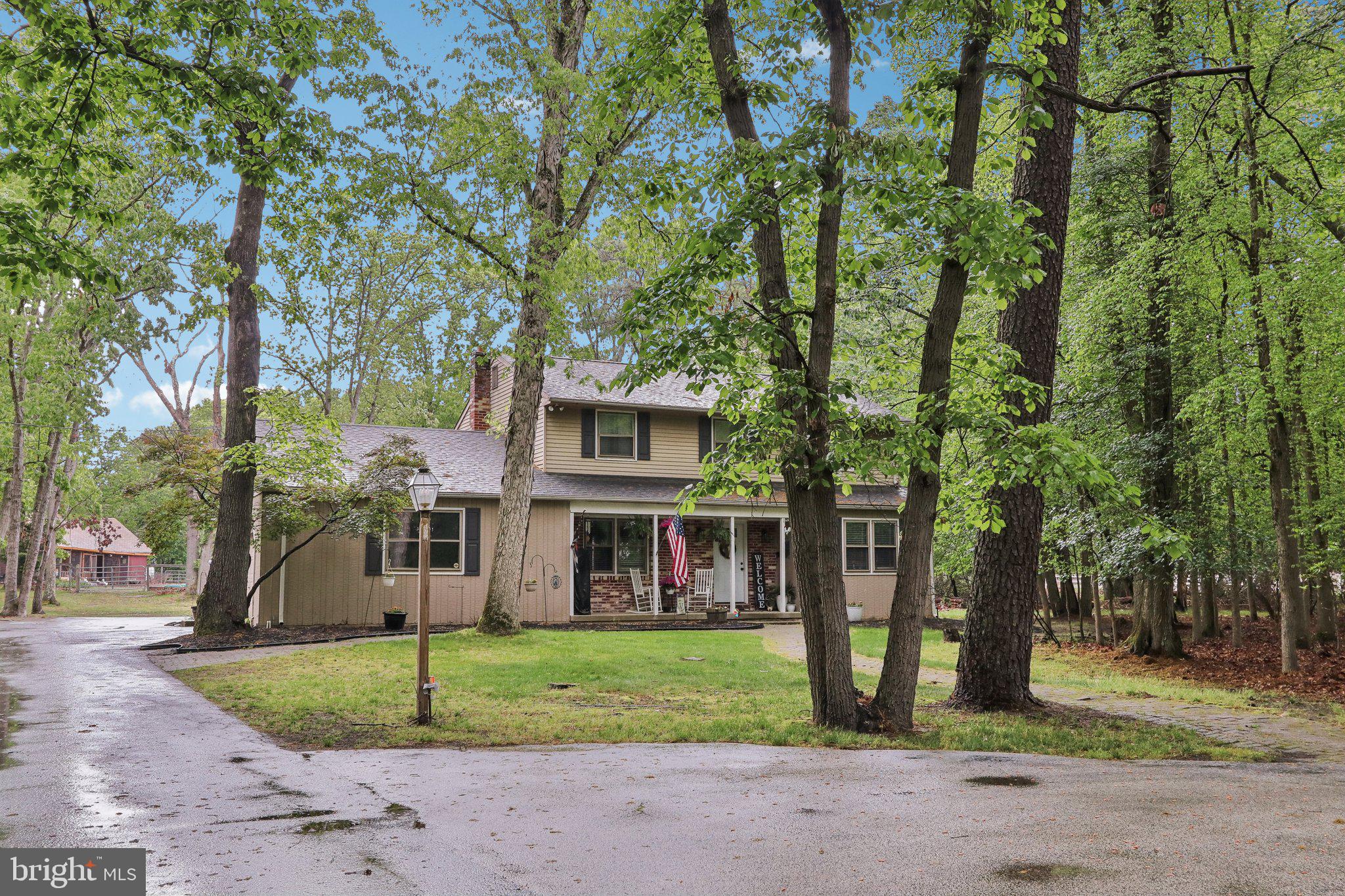 595 Tabernacle Road Medford, NJ 08055 - Photo 3 of 65 a view of a brick house with a big yard and large trees