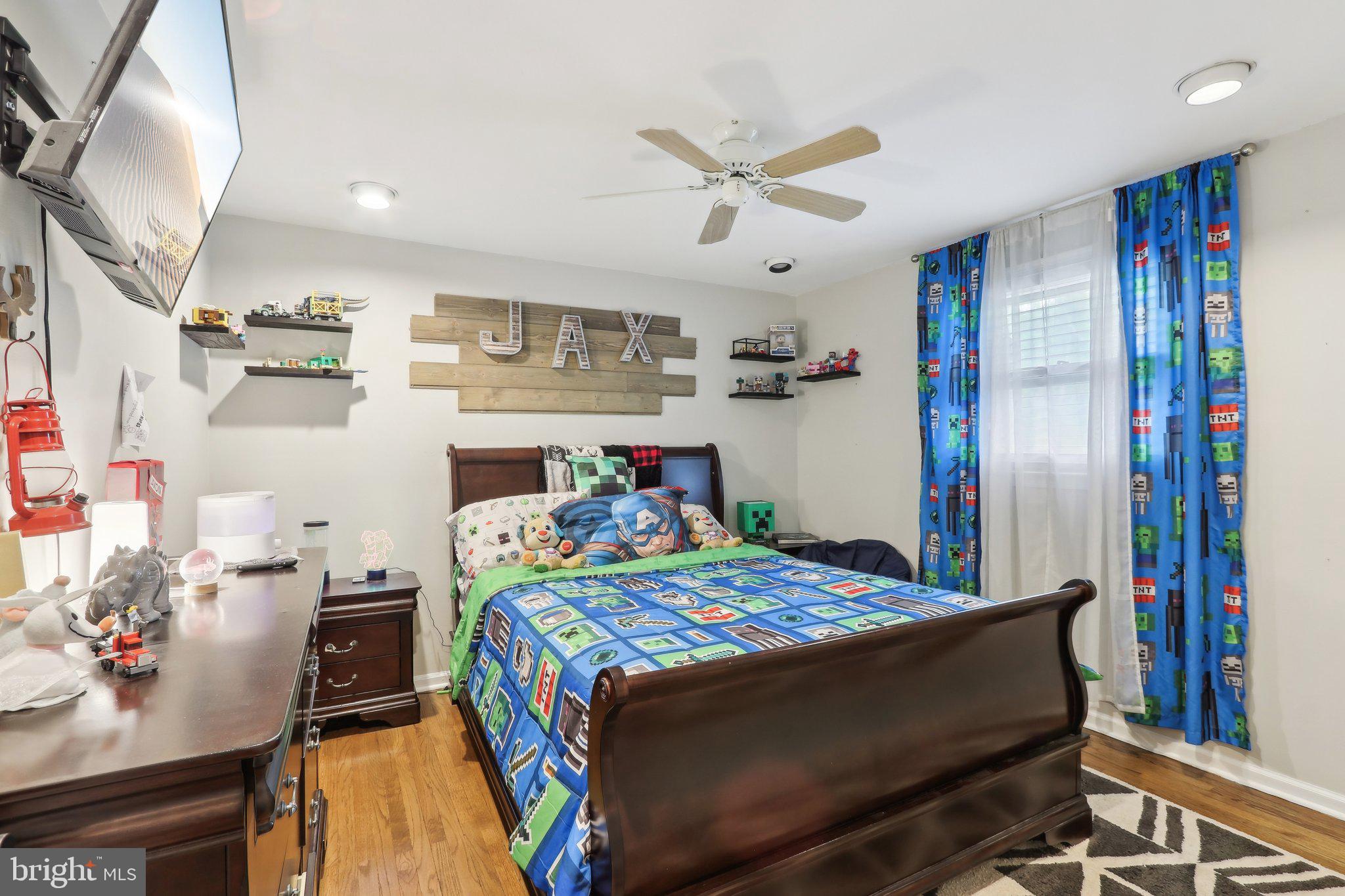 595 Tabernacle Road Medford, NJ 08055 - Photo 41 of 65 a bedroom with a bed and a chandelier
