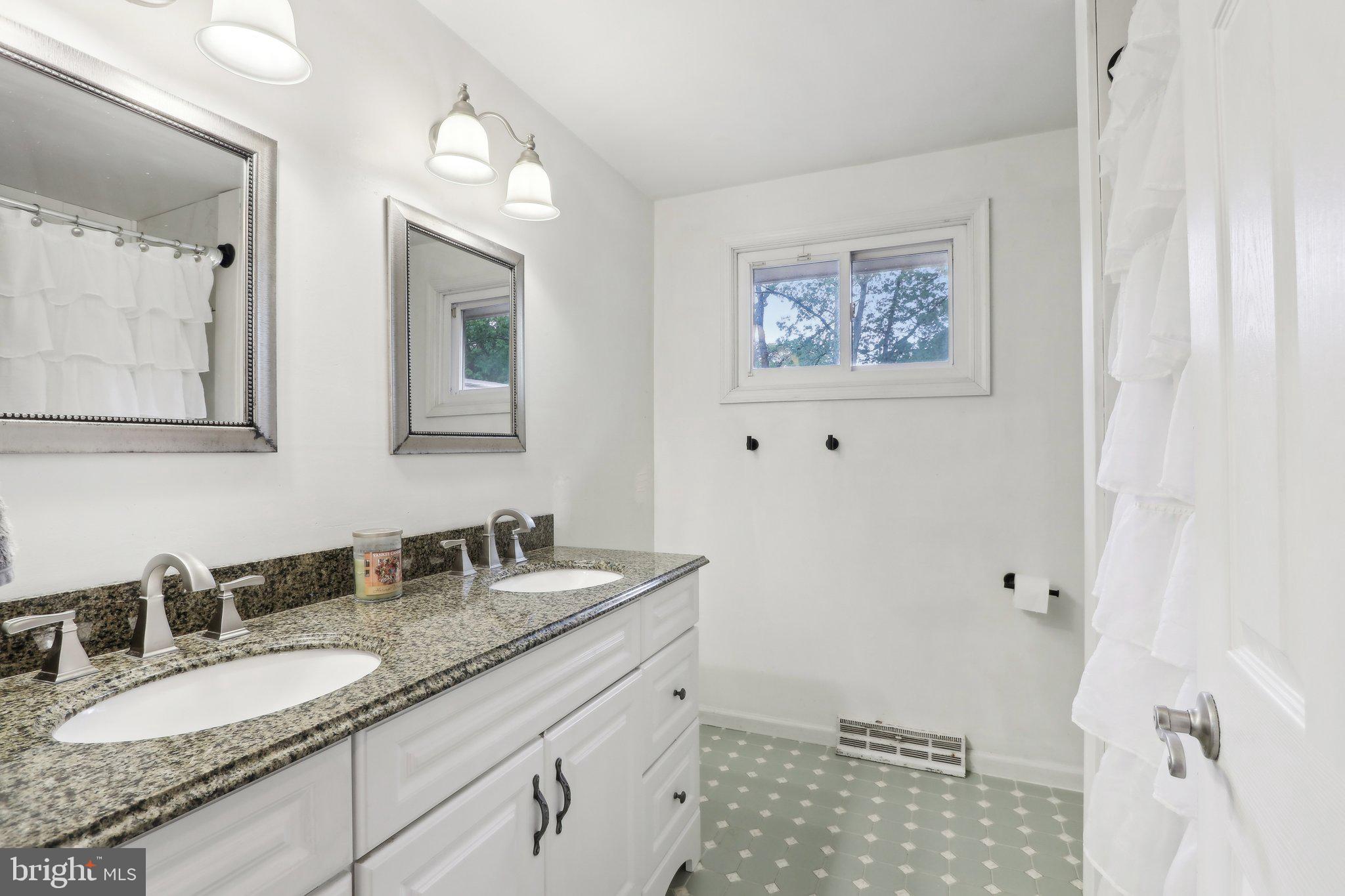 595 Tabernacle Road Medford, NJ 08055 - Photo 48 of 65 a bathroom with a granite countertop sink mirror and vanity