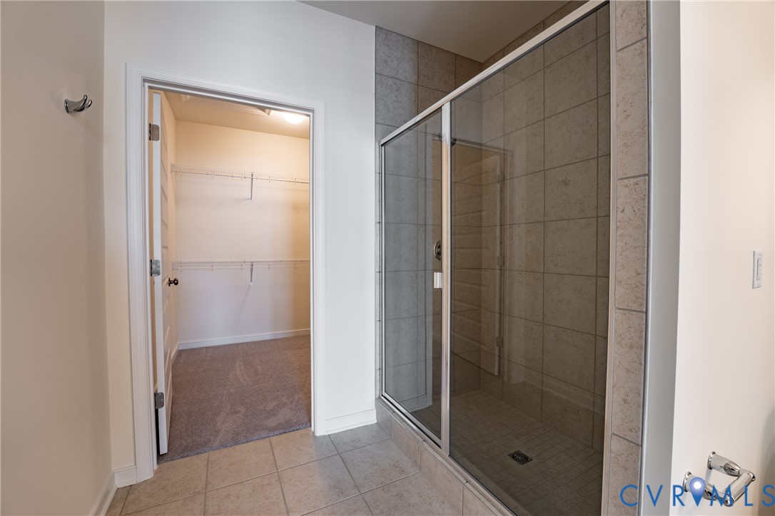 4003 Next Level Trace Midlothian, VA 23112 - Photo 16 of 38 a bathroom with a glass shower door