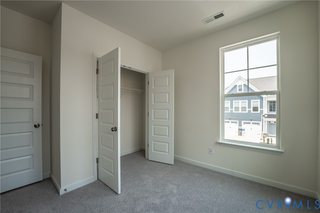4003 Next Level Trace Midlothian, VA 23112 - Photo 19 of 38 an empty room with windows and closet