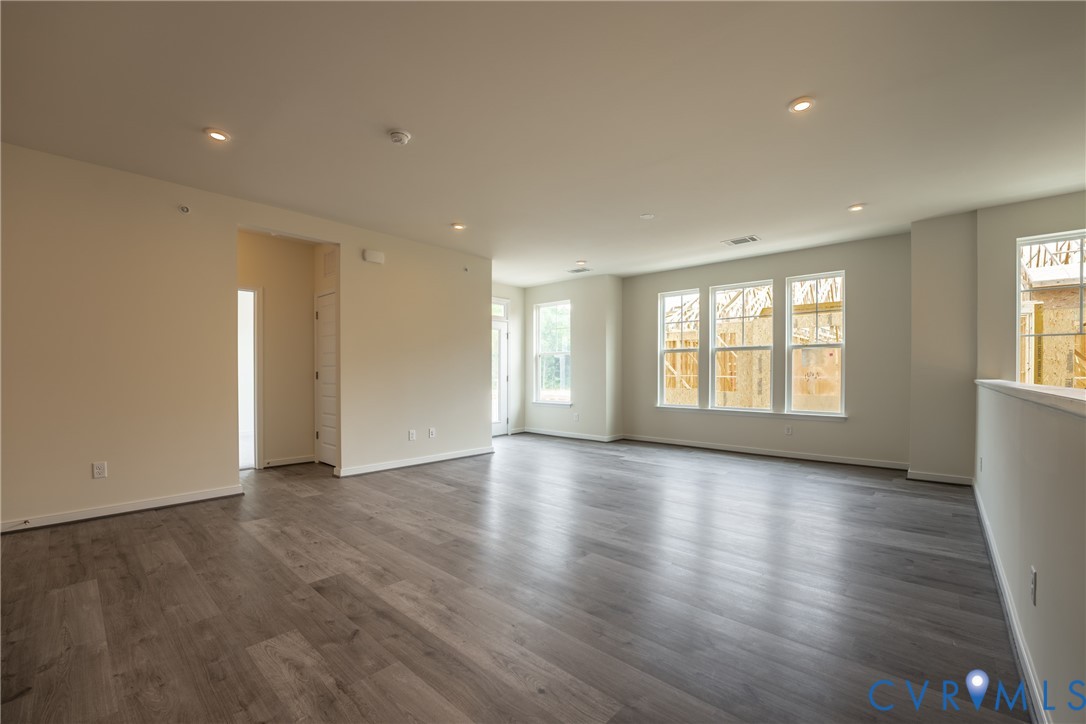 4003 Next Level Trace Midlothian, VA 23112 - Photo 4 of 38 a view of an empty room with wooden floor and a window