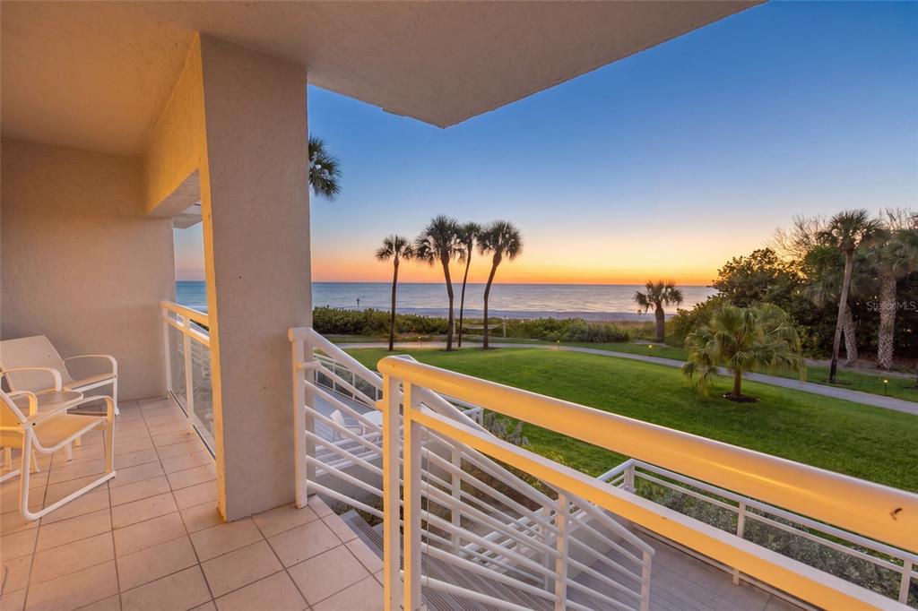 240 Sands Point Road, Unit 4104 Longboat Key, FL 34228 - Photo 24 of 47 a view of a terrace with a yard