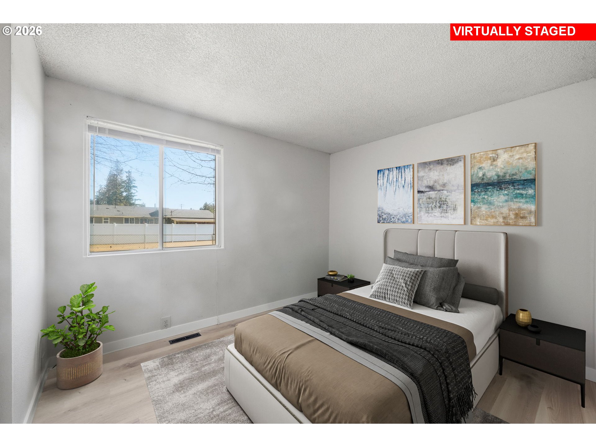 87988 6th Street Veneta, OR 97487 - Photo 17 of 20 a bedroom with a bed and a painting on the wall