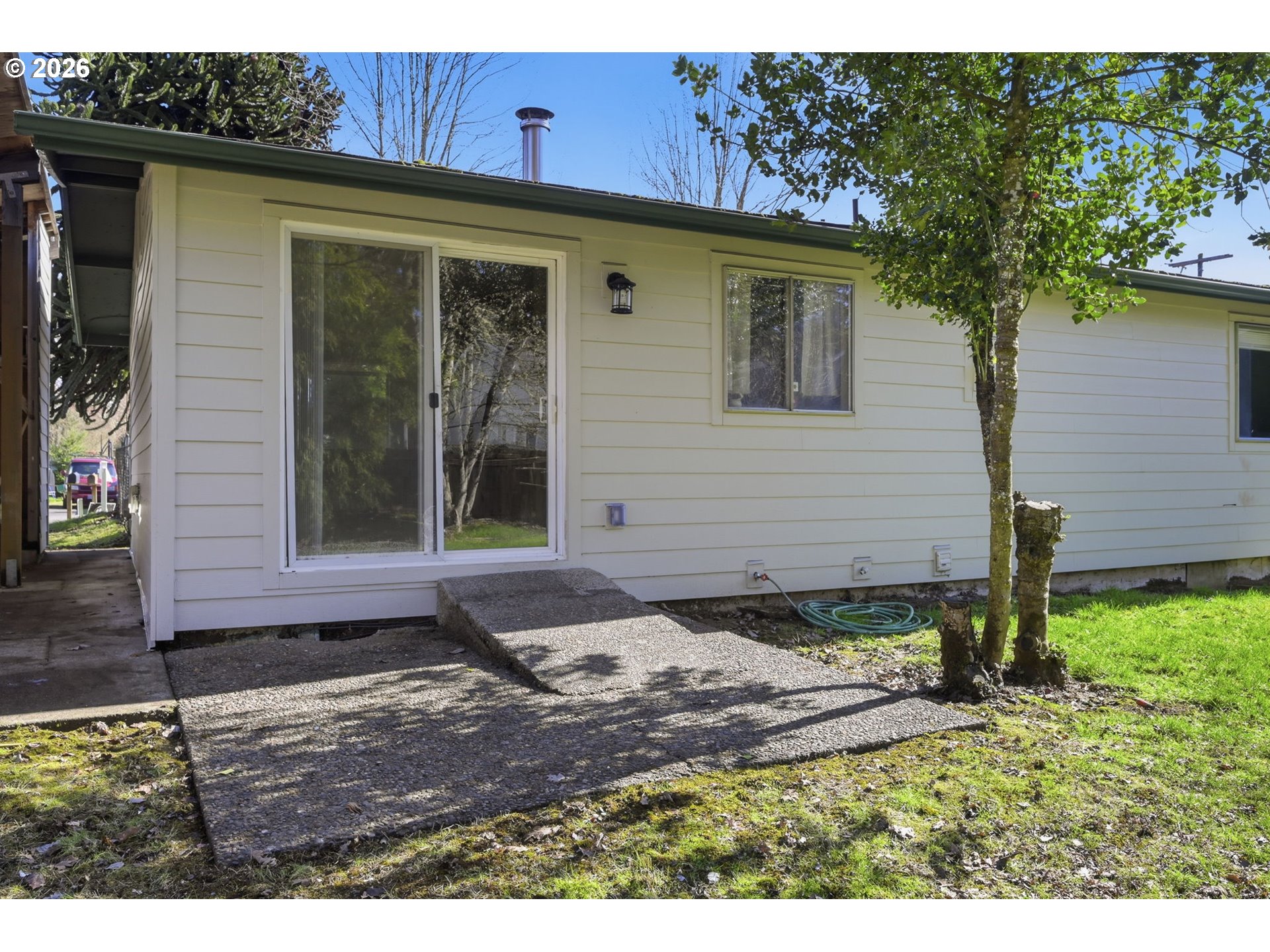 87988 6th Street Veneta, OR 97487 - Photo 18 of 20 a front view of a house with garden