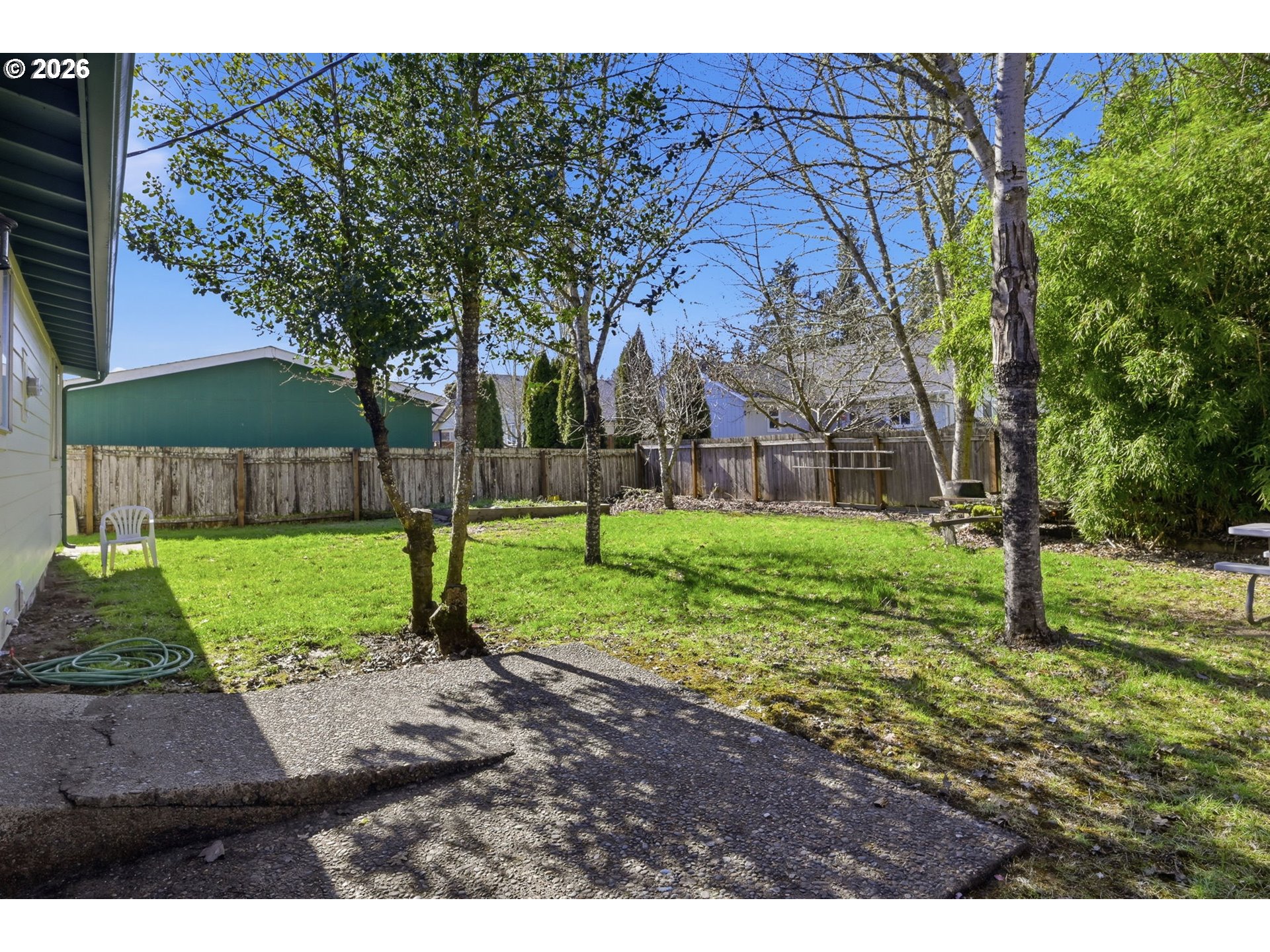 87988 6th Street Veneta, OR 97487 - Photo 19 of 20 a view of a backyard with tree s