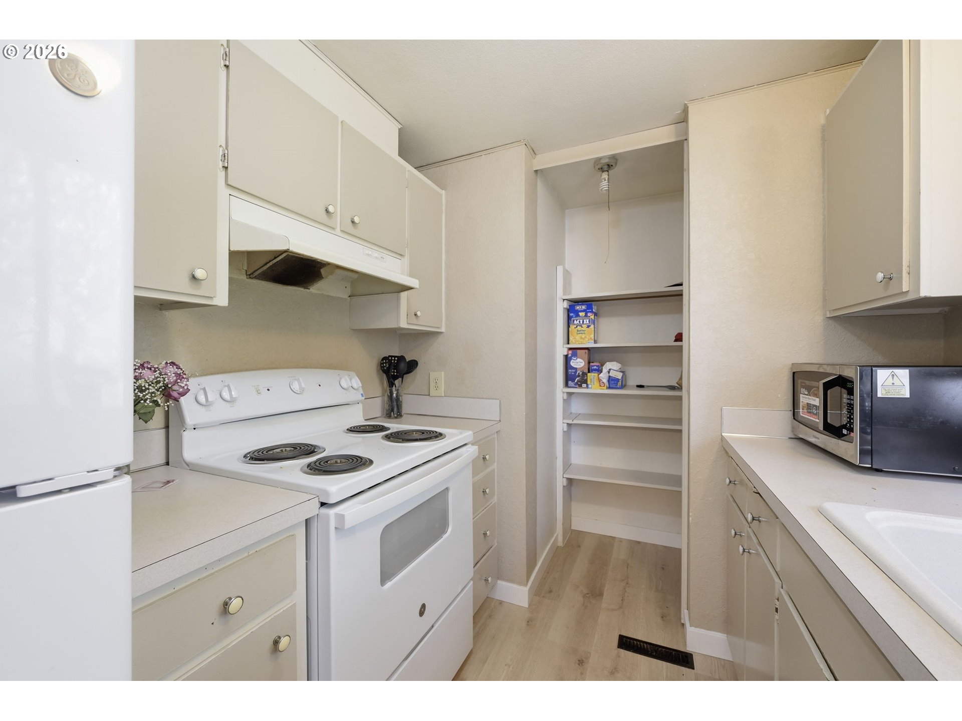 87988 6th Street Veneta, OR 97487 - Photo 10 of 20 a kitchen with stainless steel appliances a stove a sink and cabinets