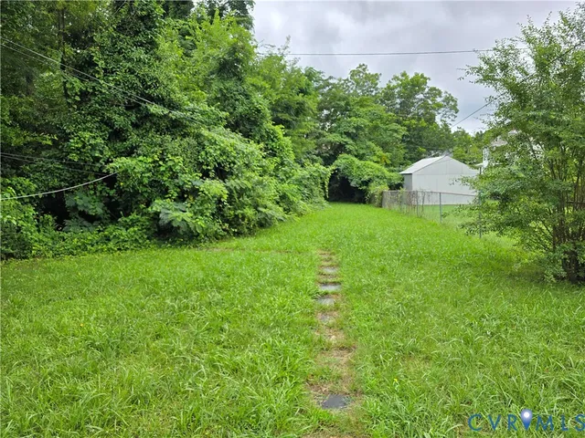 a view of a back yard of the house