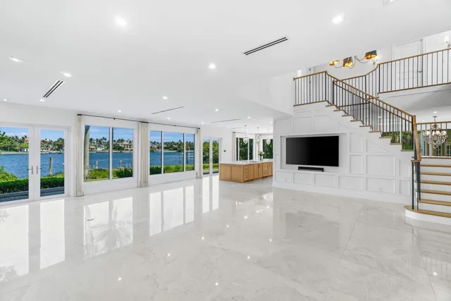 a view of a porch with a table and chairs
