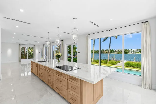 a bathroom with a granite countertop sink mirror and