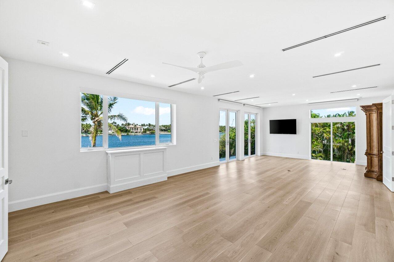 1690 Lands End Road Manalapan, FL 33462 - Photo 25 of 59 wooden floor in an empty room with a window