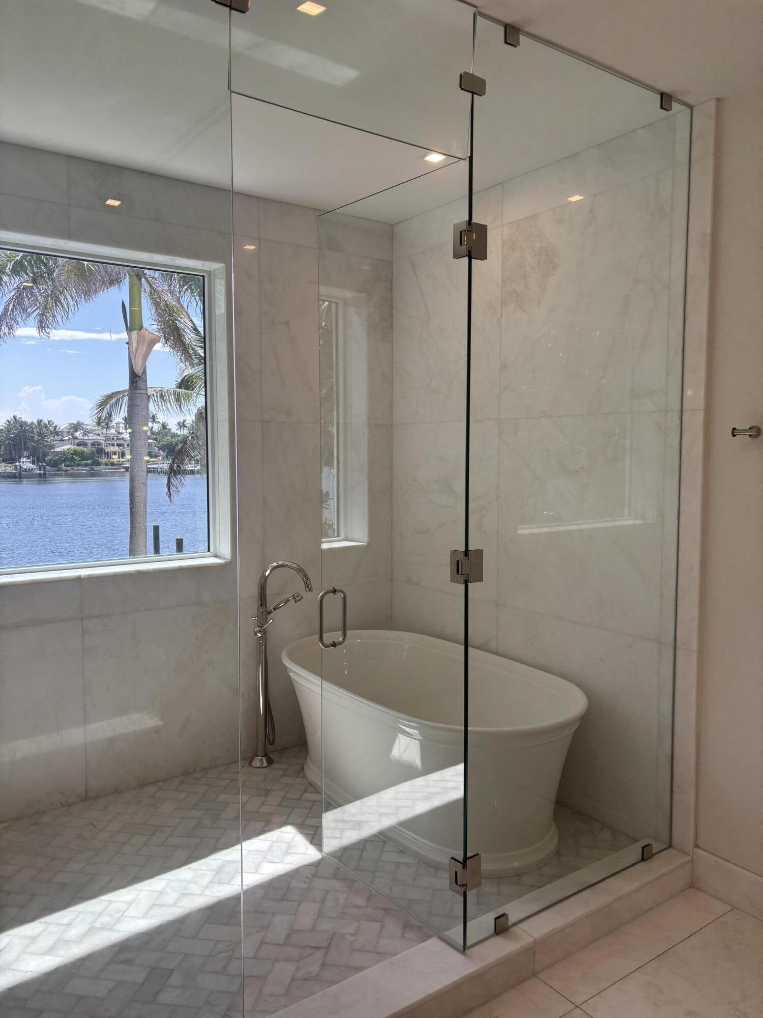 1690 Lands End Road Manalapan, FL 33462 - Photo 34 of 59 a bathroom with a tub and a shower