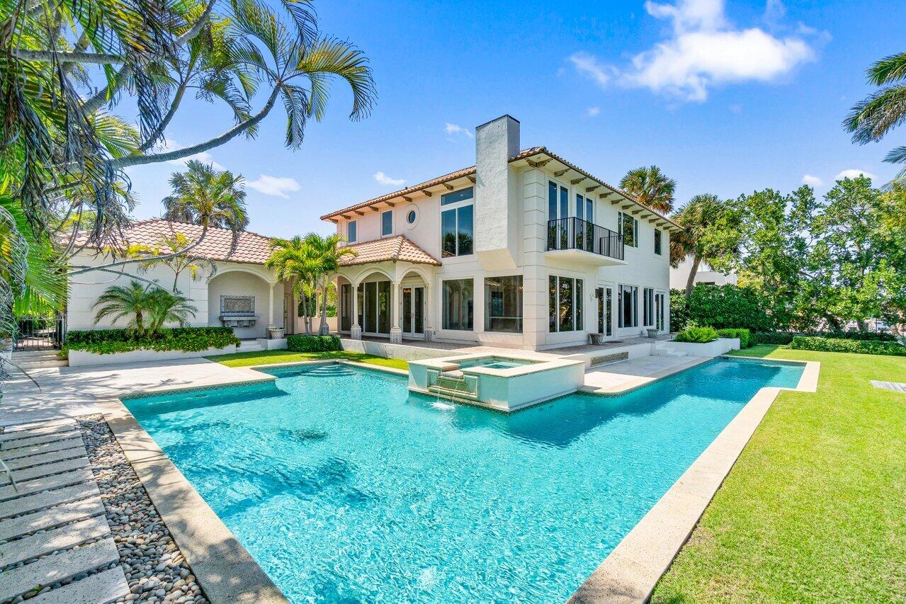 1690 Lands End Road Manalapan, FL 33462 - Photo 4 of 59 a view of a house with swimming pool and a yard