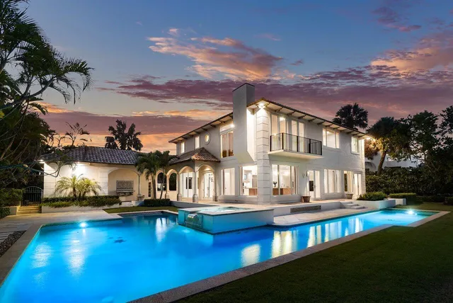 a view of white house with a yard