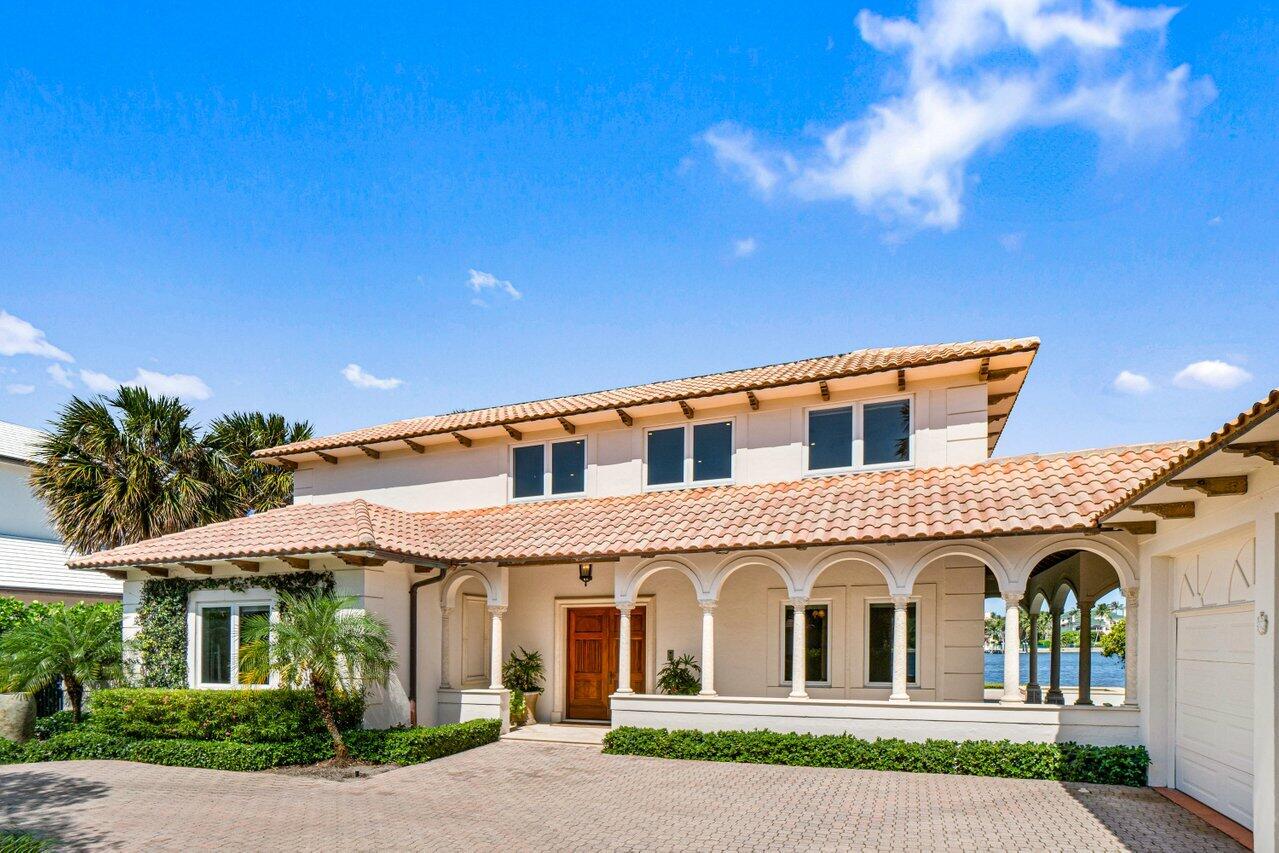 1690 Lands End Road Manalapan, FL 33462 - Photo 9 of 59 a view of white house with a yard