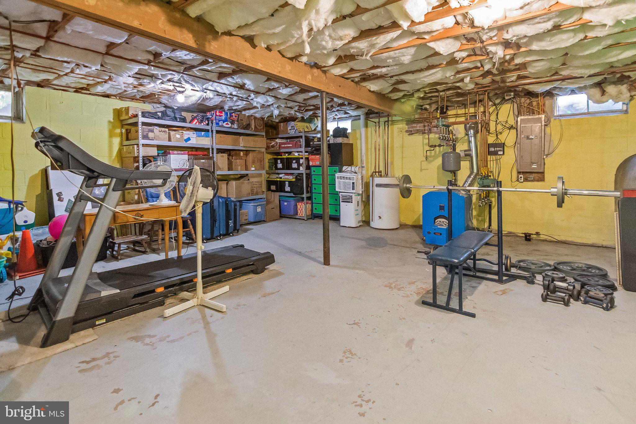 5412 Ridge Road Mount Airy, MD 21771 - Photo 27 of 38 Versatile basement for fitness and storage.