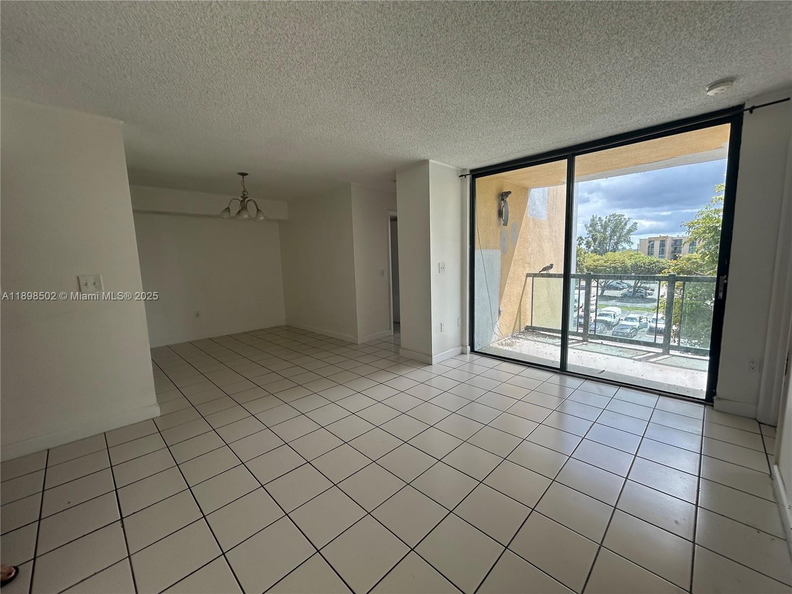 11780 Southwest 18th Street, Unit 4182 Miami, FL 33175 - Photo 12 of 14 an empty room with windows