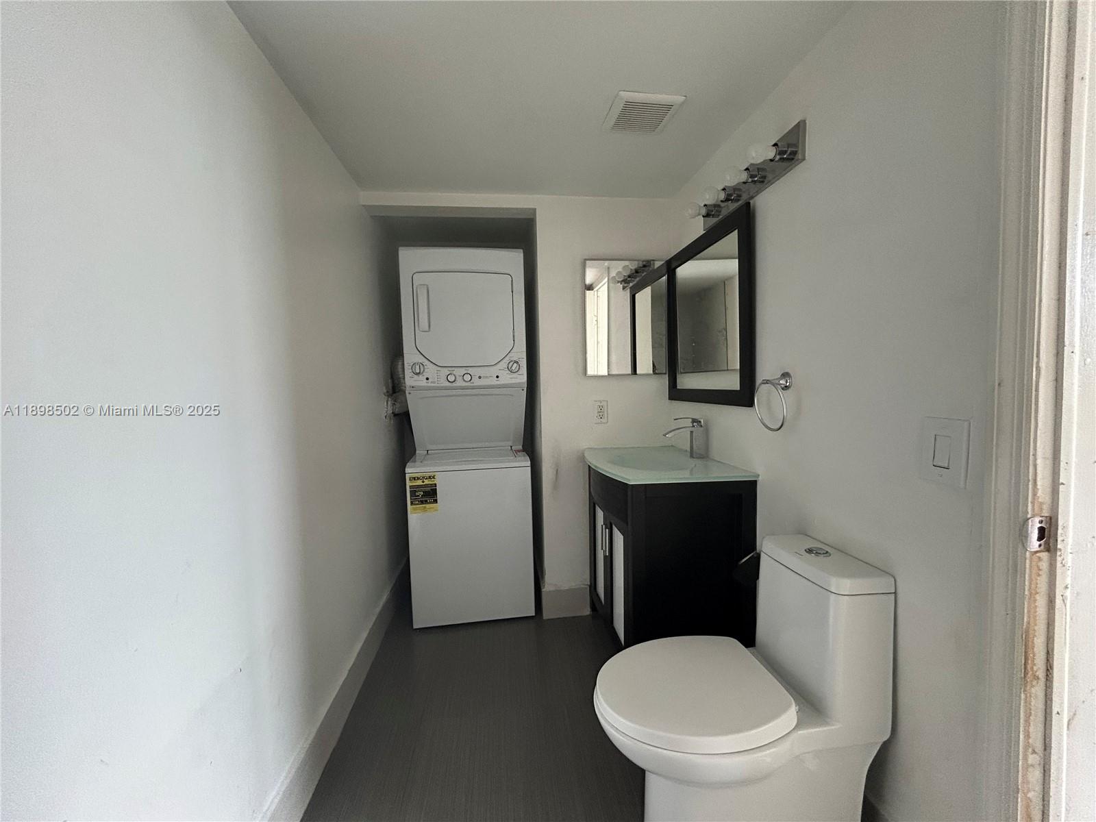 11780 Southwest 18th Street, Unit 4182 Miami, FL 33175 - Photo 4 of 14 a white toilet sitting next to a bathroom sink
