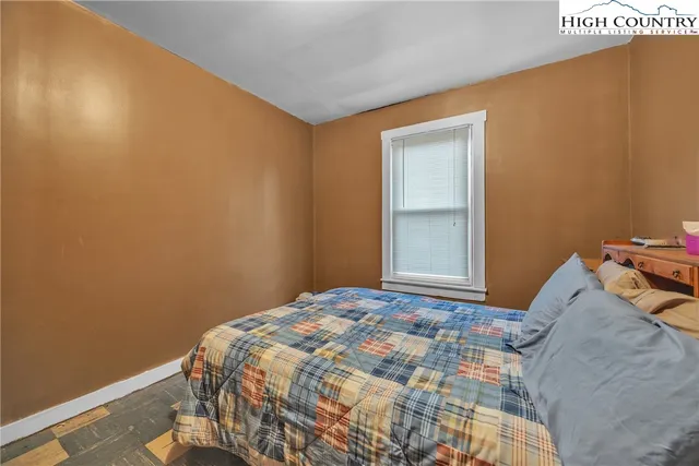 a view of backyard of house and garden