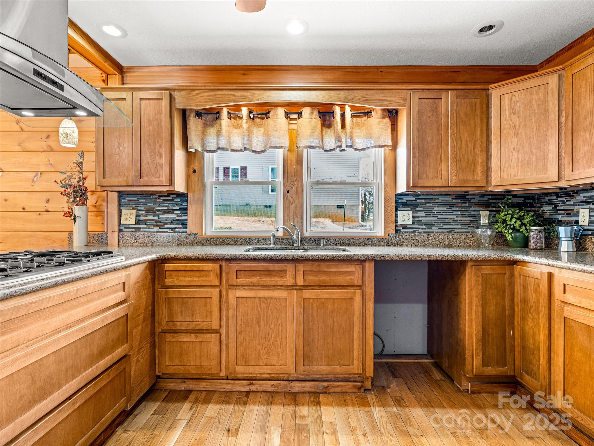 82 Morgan Street Canton, NC 28716 - Photo 18 of 45 a kitchen with granite countertop a sink and cabinets