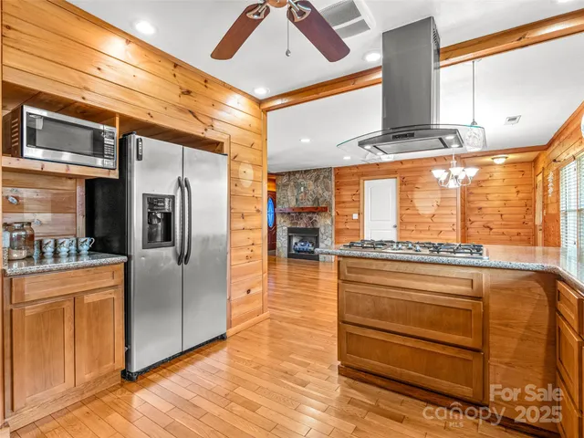a kitchen with stainless steel appliances granite countertop a stove and a sink