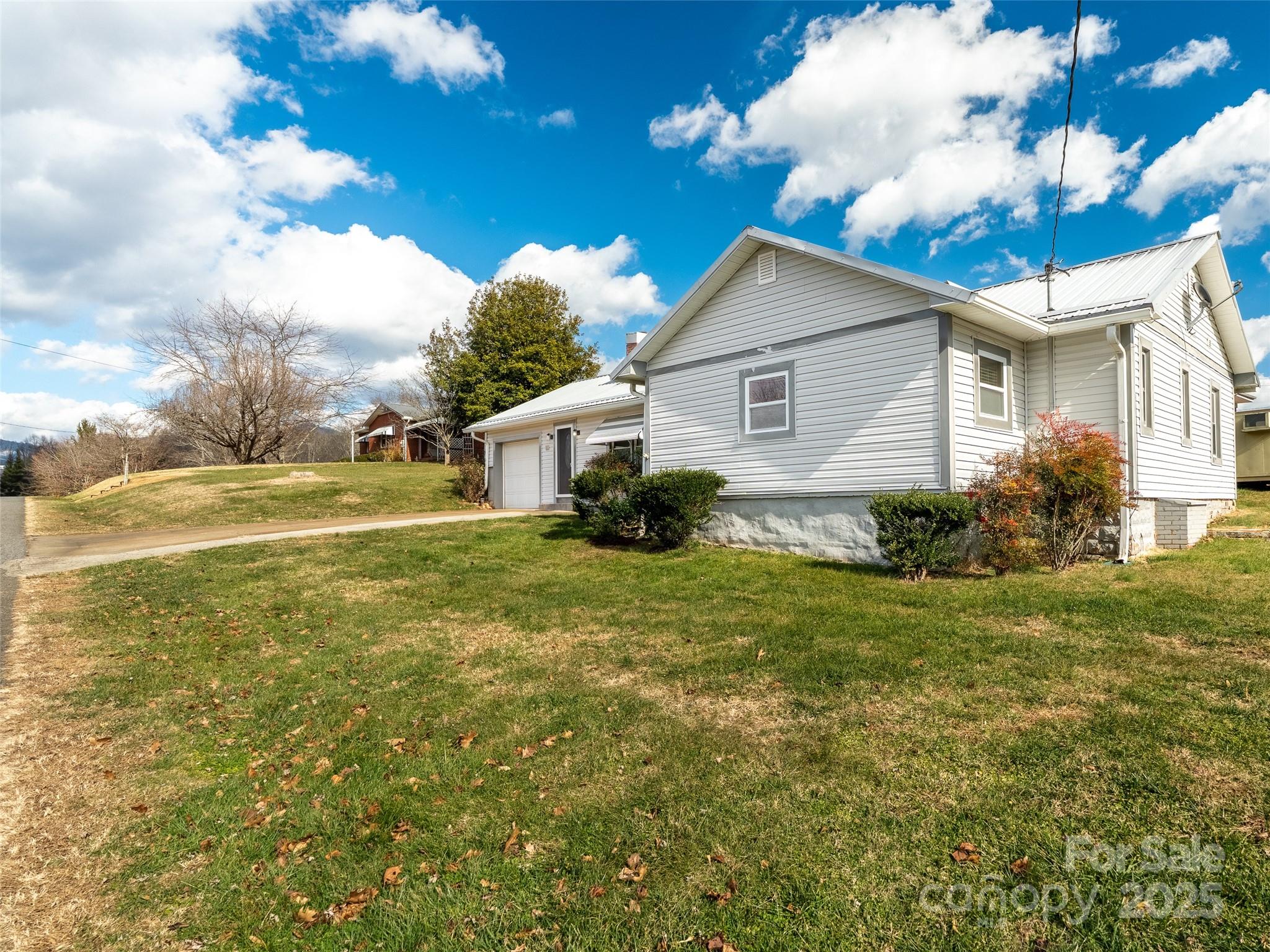 82 Morgan Street Canton, NC 28716 - Photo 3 of 45 a view of a house with a backyard