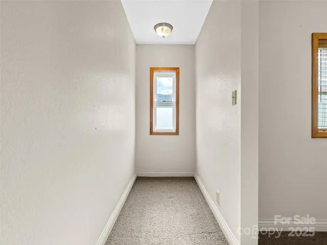 a bathroom with a double vanity sink large mirror and a bathtub