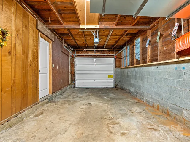 a view of a room with wooden walls