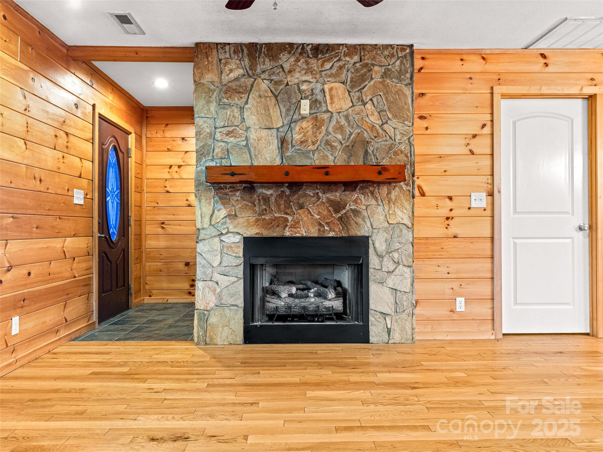 82 Morgan Street Canton, NC 28716 - Photo 7 of 45 a view of an empty room with a fireplace and a window