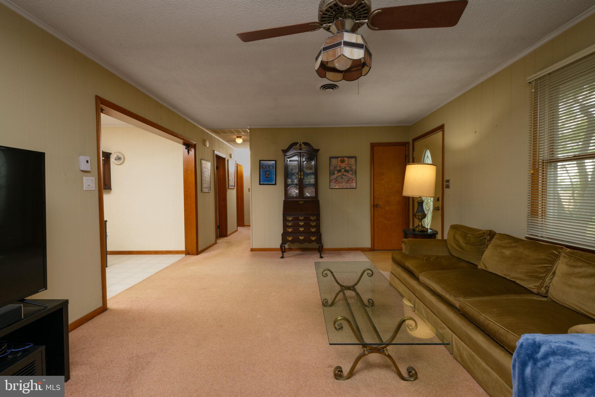 32517 Molly Field Road Dagsboro, DE 19939 - Photo 18 of 25 Spacious living area with warm tones.