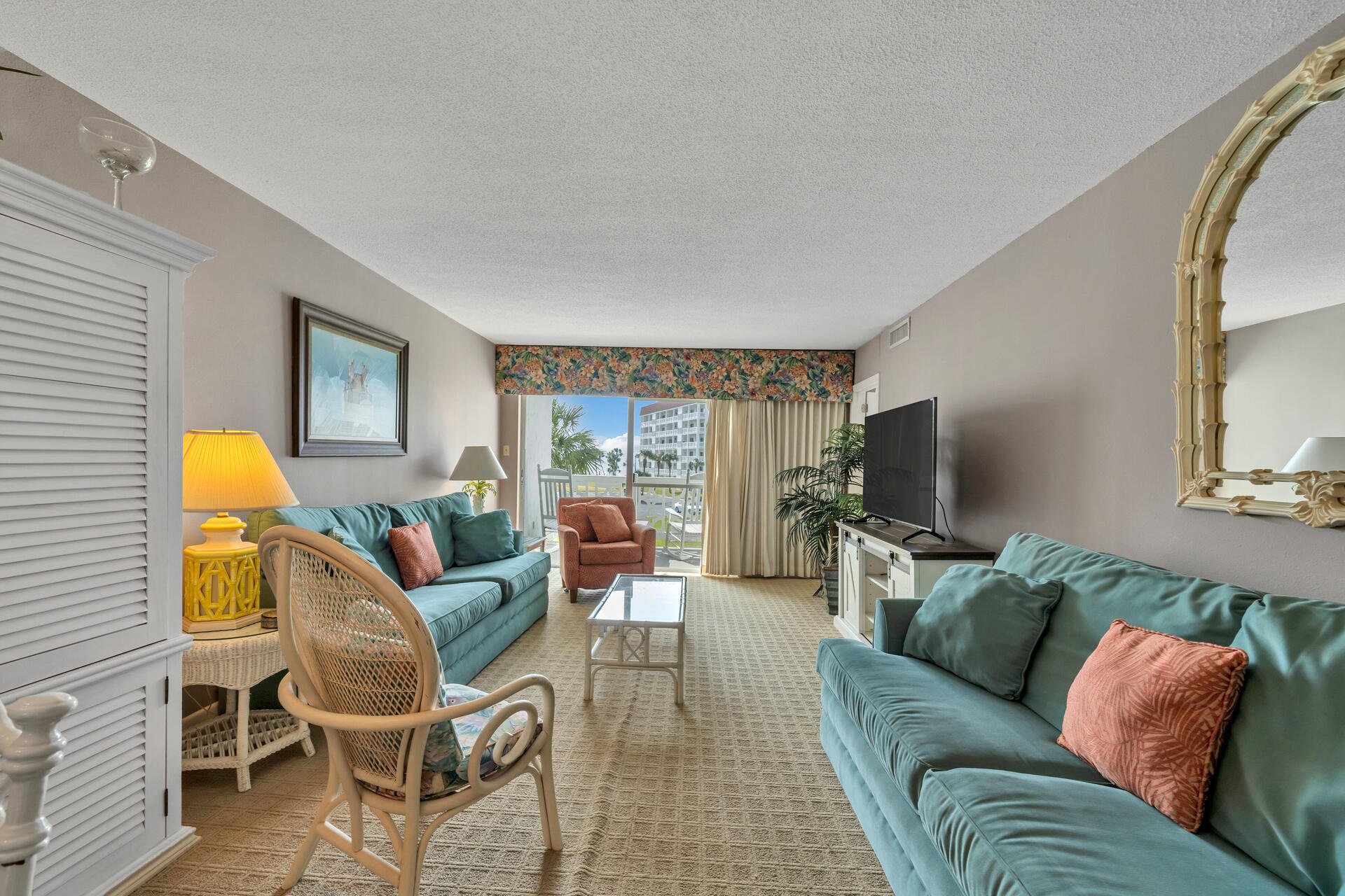 909 Santa Rosa Boulevard, Unit 138 Fort Walton Beach, FL 32548 - Photo 11 of 27 a living room with furniture and a flat screen tv