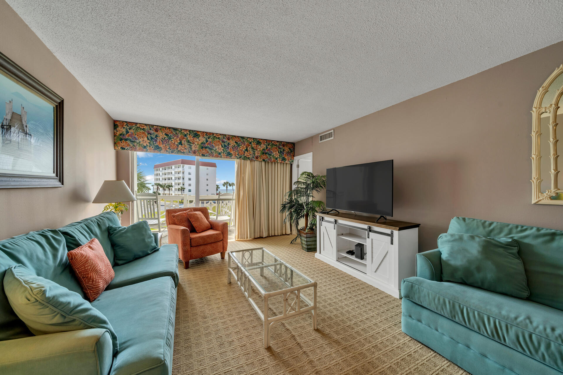 909 Santa Rosa Boulevard, Unit 138 Fort Walton Beach, FL 32548 - Photo 12 of 27 a living room with furniture and a flat screen tv