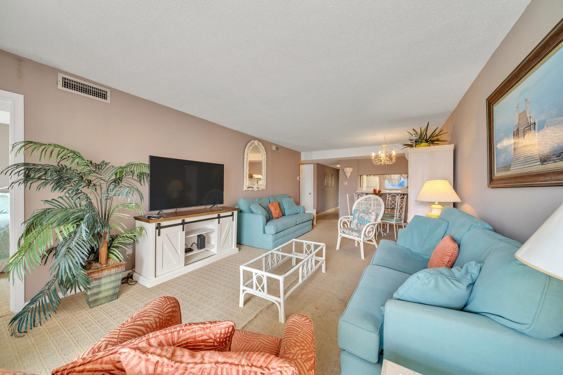 909 Santa Rosa Boulevard, Unit 138 Fort Walton Beach, FL 32548 - Photo 14 of 27 a living room with furniture and a flat screen tv