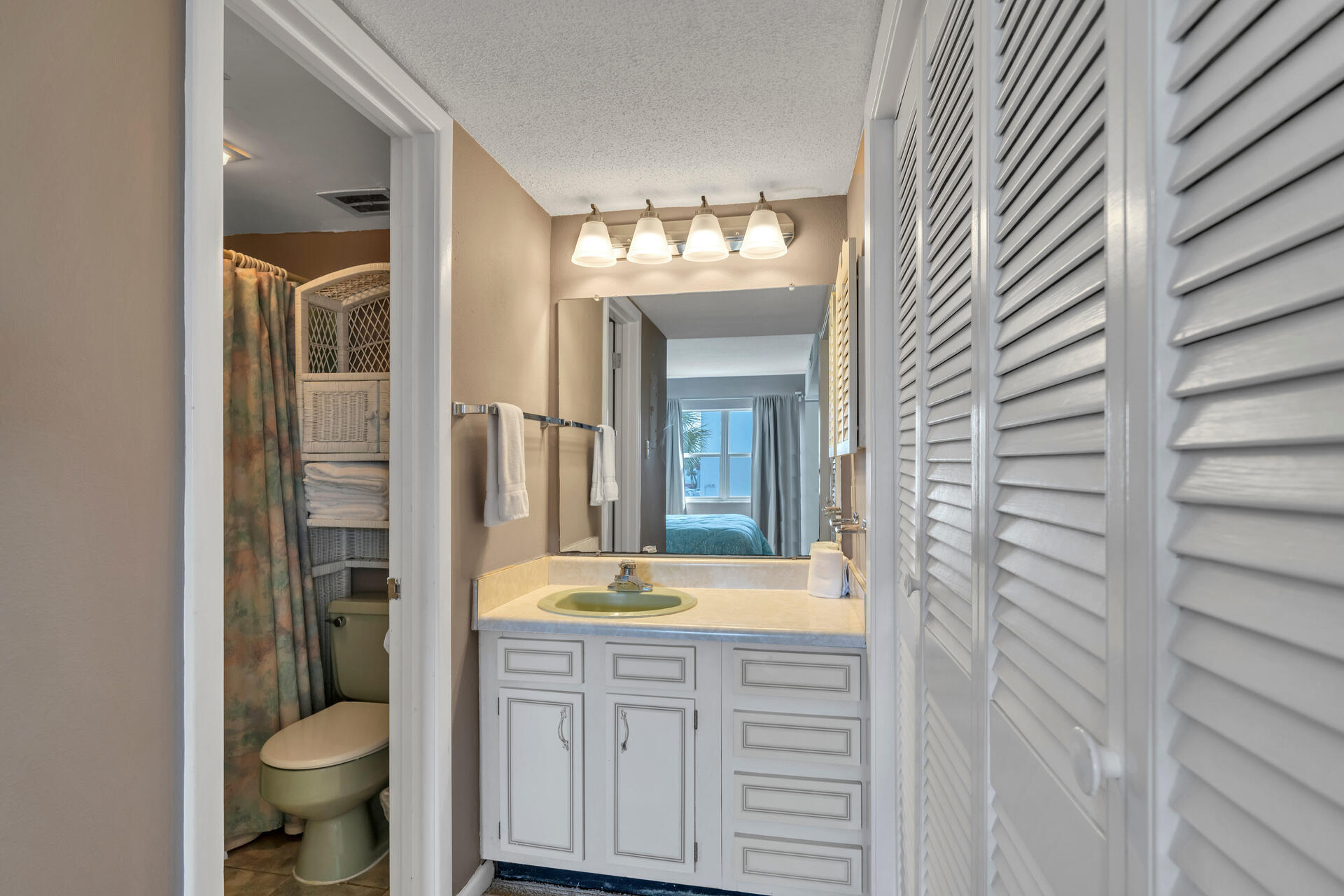 909 Santa Rosa Boulevard, Unit 138 Fort Walton Beach, FL 32548 - Photo 18 of 27 a bathroom with a granite countertop sink toilet and shower