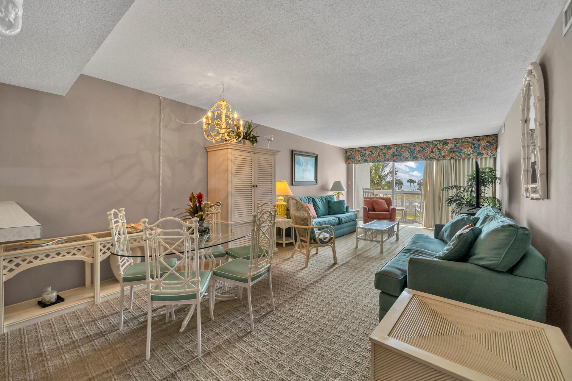 909 Santa Rosa Boulevard, Unit 138 Fort Walton Beach, FL 32548 - Photo 8 of 27 a living room with furniture a rug and a floor to ceiling window