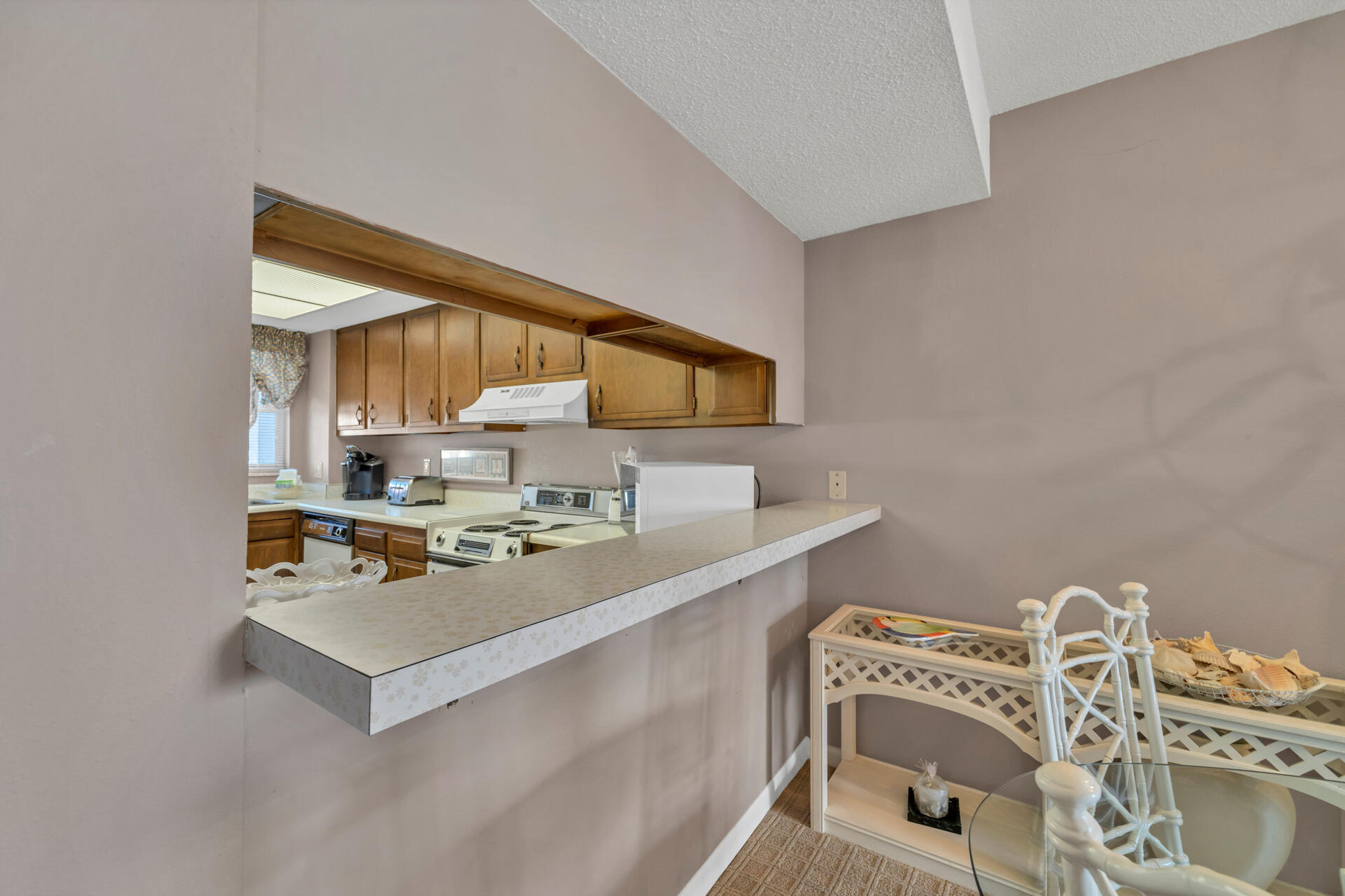 909 Santa Rosa Boulevard, Unit 138 Fort Walton Beach, FL 32548 - Photo 9 of 27 a kitchen with a sink cabinets and a window