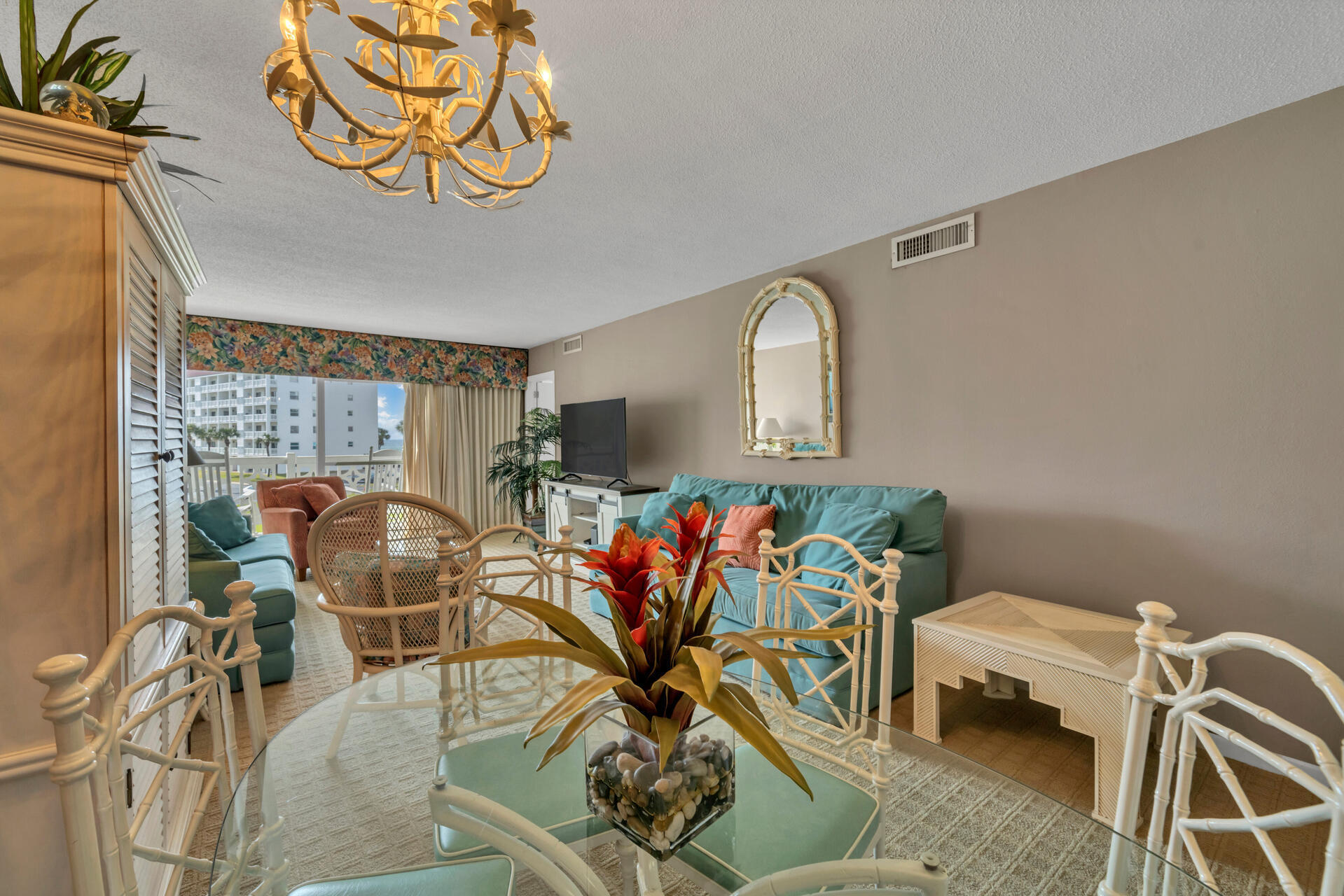 909 Santa Rosa Boulevard, Unit 138 Fort Walton Beach, FL 32548 - Photo 10 of 27 a view of a dining room with furniture a rug and wooden floor
