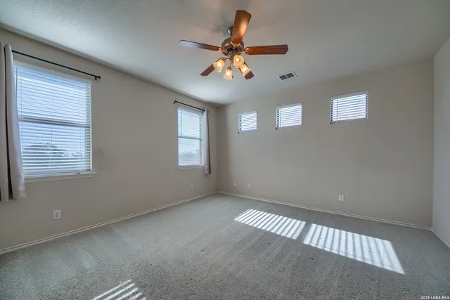 a bathroom with a double vanity sink a mirror and a bathtub