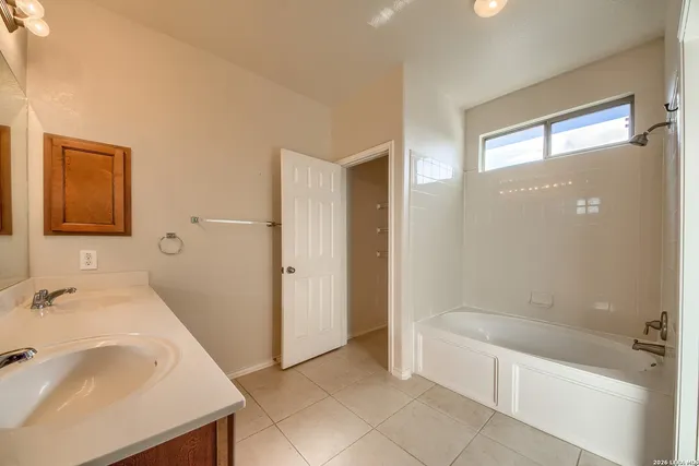 a view of an empty room with windows