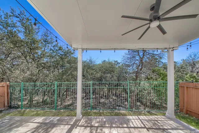 a view of a house with a yard and lawn chairs and a yard