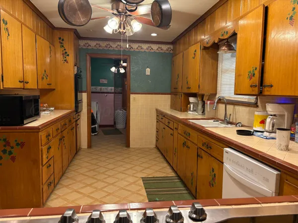a bathroom with a sink a vanity and a mirror