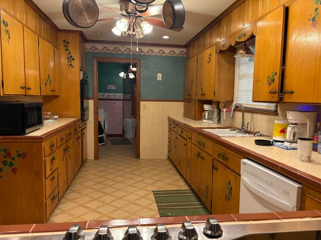 a bathroom with a sink a vanity and a mirror