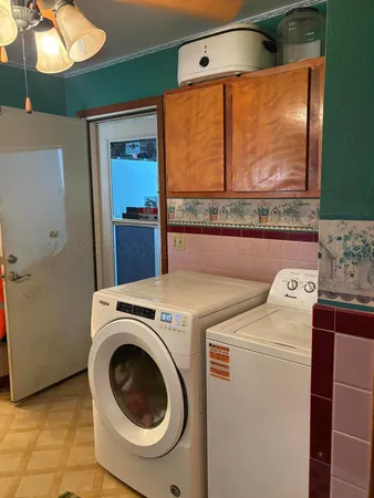 a utility room with dryer and washer